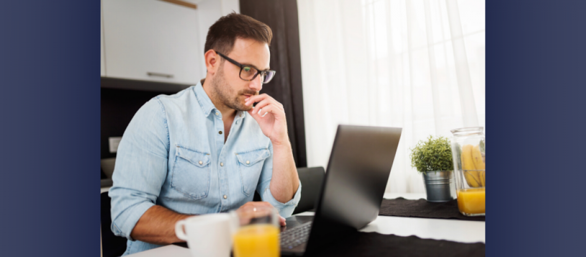 man working from home on laptop